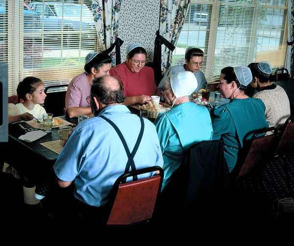 Amish family meal spread on a long table